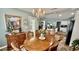 Charming dining room with chandelier, connected to kitchen and living area with natural light and stylish decor at 1300 Ruddy Ct., Conway, SC 29527