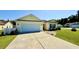 Well-maintained single Gathering home with a driveway, attached garage, and manicured lawn at 1300 Ruddy Ct., Conway, SC 29527