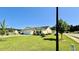 Charming, yellow single-story home with a well-manicured lawn and attached garage, nestled in a quiet neighborhood at 1300 Ruddy Ct., Conway, SC 29527