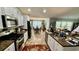 Open-concept kitchen with stainless steel appliances seamlessly connects to the dining area, creating an inviting living space at 1300 Ruddy Ct., Conway, SC 29527