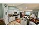 Bright kitchen features white cabinets, stainless steel appliances, and an open floor plan leading to the dining area at 1300 Ruddy Ct., Conway, SC 29527