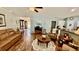 Well-lit living room with open access to the kitchen, hardwood floors, and comfortable seating at 1300 Ruddy Ct., Conway, SC 29527