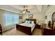 Relaxing main bedroom with tray ceiling, ceiling fan, and large window, creating a cozy retreat at 1300 Ruddy Ct., Conway, SC 29527