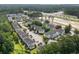 Aerial shot of townhouse complex, showing roof lines, parking, and green landscaping at 134 Scotch Broom Dr. # K - 201, Little River, SC 29566