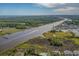Scenic aerial view of the coastline, waterways, and community featuring a pool and boat access at 134 Scotch Broom Dr. # K - 201, Little River, SC 29566