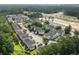 Aerial view of townhouse complex, showing roof lines, parking, and green landscaping at 134 Scotch Broom Dr. # K - 201, Little River, SC 29566