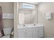 Bathroom featuring double sinks, white cabinets, large mirror, and neutral wall color at 134 Scotch Broom Dr. # K - 201, Little River, SC 29566