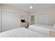 Comfortable bedroom with two beds, neutral decor, and ample closet space, ideal for a restful retreat at 134 Scotch Broom Dr. # K - 201, Little River, SC 29566
