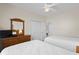 Cozy bedroom with twin beds, wooden dresser, and closet, perfect for guests or children at 134 Scotch Broom Dr. # K - 201, Little River, SC 29566