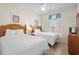Comfortable bedroom with two queen beds, wood headboards, and matching nightstand and dresser at 134 Scotch Broom Dr. # K - 201, Little River, SC 29566