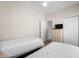 Well-lit bedroom with twin beds, wooden dresser, and closet, ideal for guests or children at 134 Scotch Broom Dr. # K - 201, Little River, SC 29566