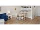 Cozy dining area with seating for four and a breakfast bar, great for enjoying meals with Gathering and friends at 134 Scotch Broom Dr. # K - 201, Little River, SC 29566