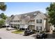 Attractive condominium building with well-maintained landscaping and ample parking space at 134 Scotch Broom Dr. # K - 201, Little River, SC 29566