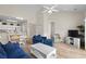 Cozy open living room with vaulted ceilings, a ceiling fan, and view of the kitchen and dining area at 134 Scotch Broom Dr. # K - 201, Little River, SC 29566