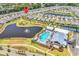 Overhead view of a community featuring a pool, lake, golf, and tennis amenities at 1360 Littleleaf Loop, North Myrtle Beach, SC 29582