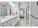Bright bathroom with double sink vanity, walk-in shower, and modern fixtures at 1360 Littleleaf Loop, North Myrtle Beach, SC 29582