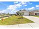 Charming exterior view with a well-manicured lawn and landscaping at 1360 Littleleaf Loop, North Myrtle Beach, SC 29582