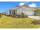 Charming home exterior with lush landscaping and a well-maintained lawn at 1360 Littleleaf Loop, North Myrtle Beach, SC 29582