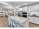 Bright, open kitchen with stainless steel appliances, granite counters, and breakfast bar seating at 1360 Littleleaf Loop, North Myrtle Beach, SC 29582