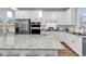 Bright kitchen showcasing white cabinets, stainless steel appliances, and granite countertops at 1360 Littleleaf Loop, North Myrtle Beach, SC 29582