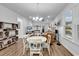 Cozy living room with hardwood floors, neutral paint, and a view to the backyard at 1360 Littleleaf Loop, North Myrtle Beach, SC 29582