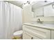Bathroom featuring a shower with curtain, modern vanity with a chrome faucet, and a toilet at 1425 Teague Rd. # 203, Myrtle Beach, SC 29577