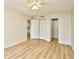 Bedroom features laminate wood flooring, ceiling fan, and a closet at 1425 Teague Rd. # 203, Myrtle Beach, SC 29577
