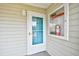 Inviting condo entrance featuring a screen door with a convenient fire extinguisher box at 1425 Teague Rd. # 203, Myrtle Beach, SC 29577