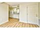 Bright kitchen featuring wood look flooring, and white appliances at 1425 Teague Rd. # 203, Myrtle Beach, SC 29577