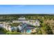 Aerial view of the complex with a swimming pool and view of the surrounding trees at 14290 Ocean Hwy. # 407, Pawleys Island, SC 29585