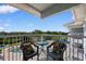 Balcony view featuring seating, a swimming pool, and a green landscape at 14290 Ocean Hwy. # 407, Pawleys Island, SC 29585