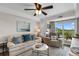 Bright living room featuring comfortable seating, balcony access, and tasteful decor for a relaxing atmosphere at 14290 Ocean Hwy. # 407, Pawleys Island, SC 29585