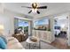 Cozy living room with beach view, sliders to balcony, comfortable seating, and easy access to the main bedroom at 14290 Ocean Hwy. # 407, Pawleys Island, SC 29585
