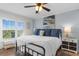 Comfortable main bedroom with ample natural light, neutral decor, ceiling fan and easy access to the bath at 14290 Ocean Hwy. # 407, Pawleys Island, SC 29585