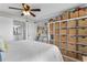 Bright main bedroom featuring ample storage with shelving units and a ceiling fan at 14290 Ocean Hwy. # 407, Pawleys Island, SC 29585