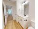 Bright bathroom featuring a white vanity with modern fixtures and stylish flooring at 1464 Hawthorn Dr., Pawleys Island, SC 29585
