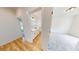 Bathroom boasts wood-look floors and modern fixtures viewable from the bedroom at 1464 Hawthorn Dr., Pawleys Island, SC 29585