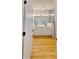 Modern bathroom with double vanity, wood floor, and glass-enclosed shower at 1464 Hawthorn Dr., Pawleys Island, SC 29585