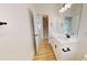 Vanity with modern fixtures, spacious countertop, and view of staircase at 1464 Hawthorn Dr., Pawleys Island, SC 29585