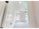 Bright bedroom with plush carpet, tray ceiling, a ceiling fan, and large windows at 1464 Hawthorn Dr., Pawleys Island, SC 29585