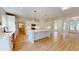 Spacious kitchen with stainless steel appliances, white cabinetry, a large island, and an open floor plan at 1464 Hawthorn Dr., Pawleys Island, SC 29585