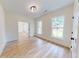 Bright living room features hardwood floors, white trim, and natural light at 1464 Hawthorn Dr., Pawleys Island, SC 29585