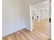 Open living space featuring plank floors, white walls, and easy access to kitchen at 1464 Hawthorn Dr., Pawleys Island, SC 29585