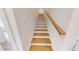 Staircase with wood treads, white risers and stringers, plus a wooden handrail at 1464 Hawthorn Dr., Pawleys Island, SC 29585