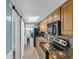 Galley kitchen with stainless appliances, granite counters, and a view to living area and ocean at 1501 S Ocean Blvd. # 639, Myrtle Beach, SC 29577