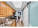 Galley kitchen with stainless appliances, granite counters, and an open doorway to the living area at 1501 S Ocean Blvd. # 639, Myrtle Beach, SC 29577