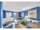 Living room with blue walls, tile floors, dining area and access to a balcony at 1501 S Ocean Blvd. # 639, Myrtle Beach, SC 29577