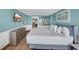 Comfortable bedroom with tile floors, beach themed art and a glimpse of the kitchen area at 1501 S Ocean Blvd. # 639, Myrtle Beach, SC 29577