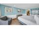 Bright bedroom features tile floors, beach themed art and a glimpse of the kitchen area at 1501 S Ocean Blvd. # 639, Myrtle Beach, SC 29577