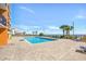 Outdoor swimming pool surrounded by palm trees and lounge chairs overlooking the beach at 1501 S Ocean Blvd. # 639, Myrtle Beach, SC 29577